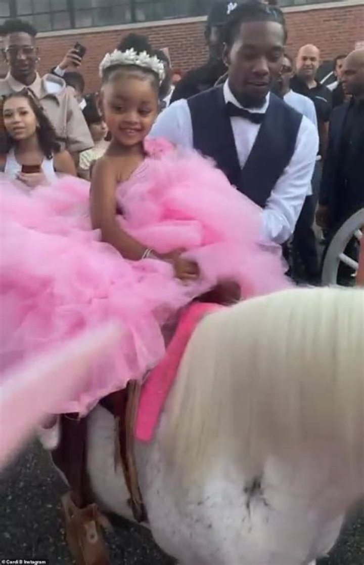 Having a ball:&nbsp;Cardi joyfully called out her daughter's name as Kulture got to enjoy a brief ride on a pony with a little unicorn horn attached to its head